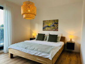 Moderne Ferienwohnung mit Terrasse, Grill & Privatparkplatz